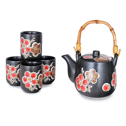 Japanese-style black ceramic tea set with red flowers including wooden handle and strainer.