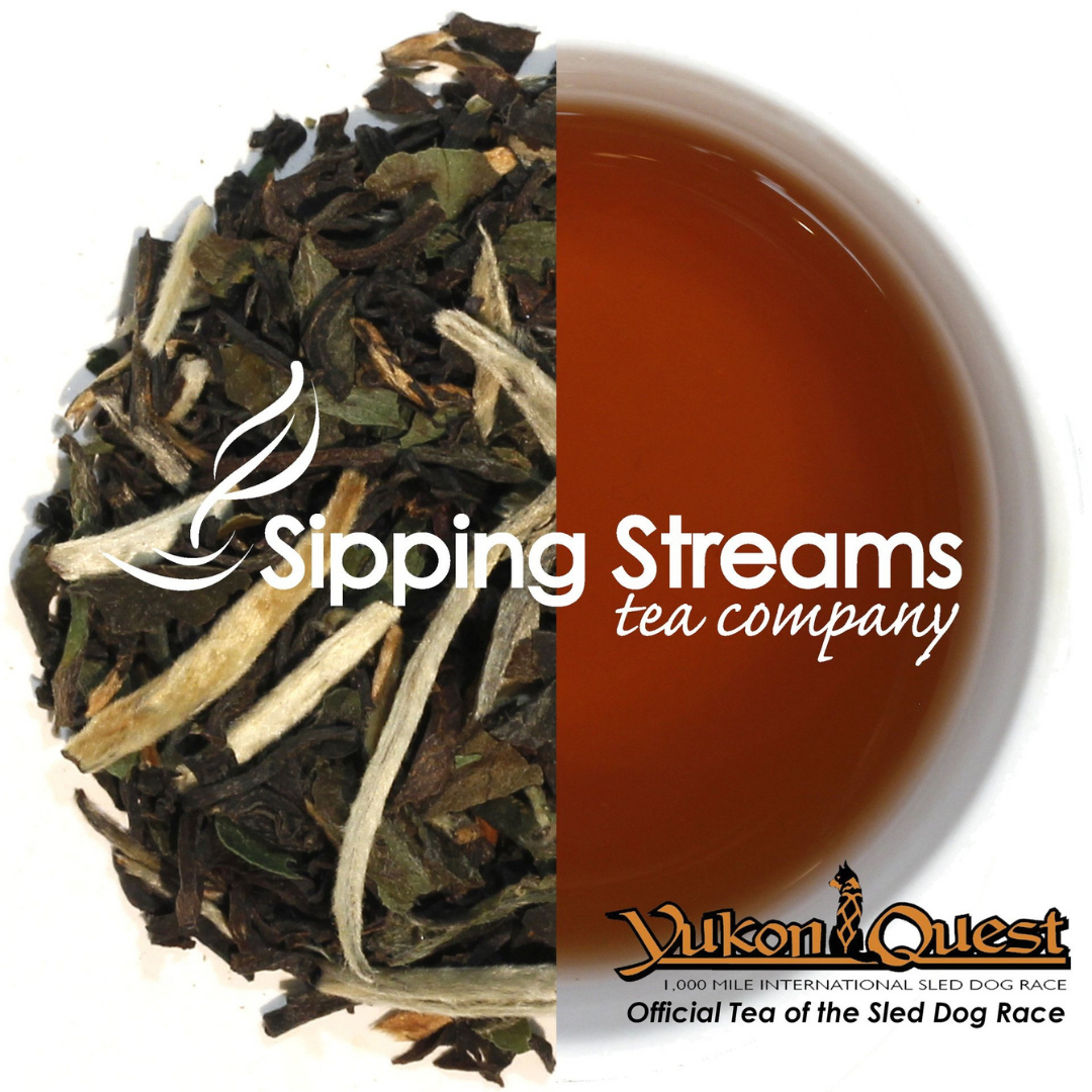 Sipping Streams Tea Company logo over a split image of loose leaf tea and a cup of tea with the Yukon Quest logo in the lower right corner.