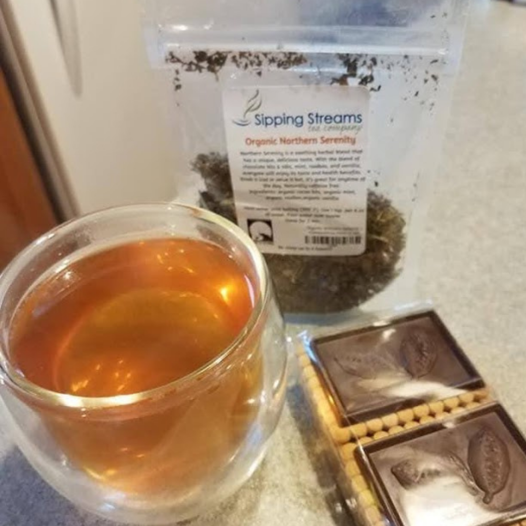 A clear cup of Organic Northern Serenity Herbal Tea Blend | Sipping Streams