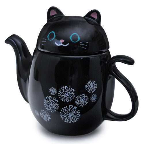 Black cat teapot with snowflake design and a strainer.