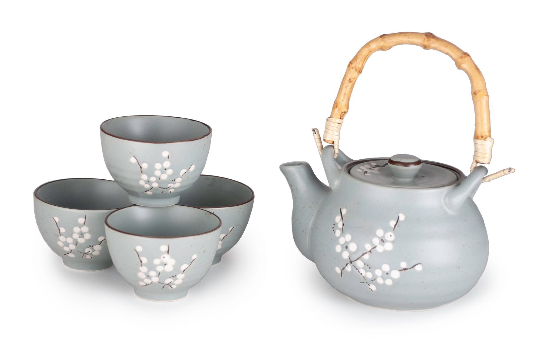 A cherry blossom tea set featuring a ceramic teapot with a natural bamboo handle and four matching cups.