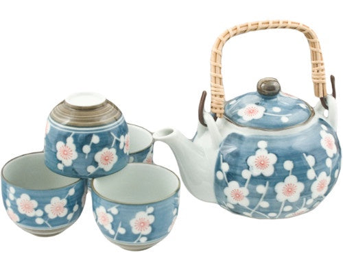 Juego de té azul con flores blancas/rosas