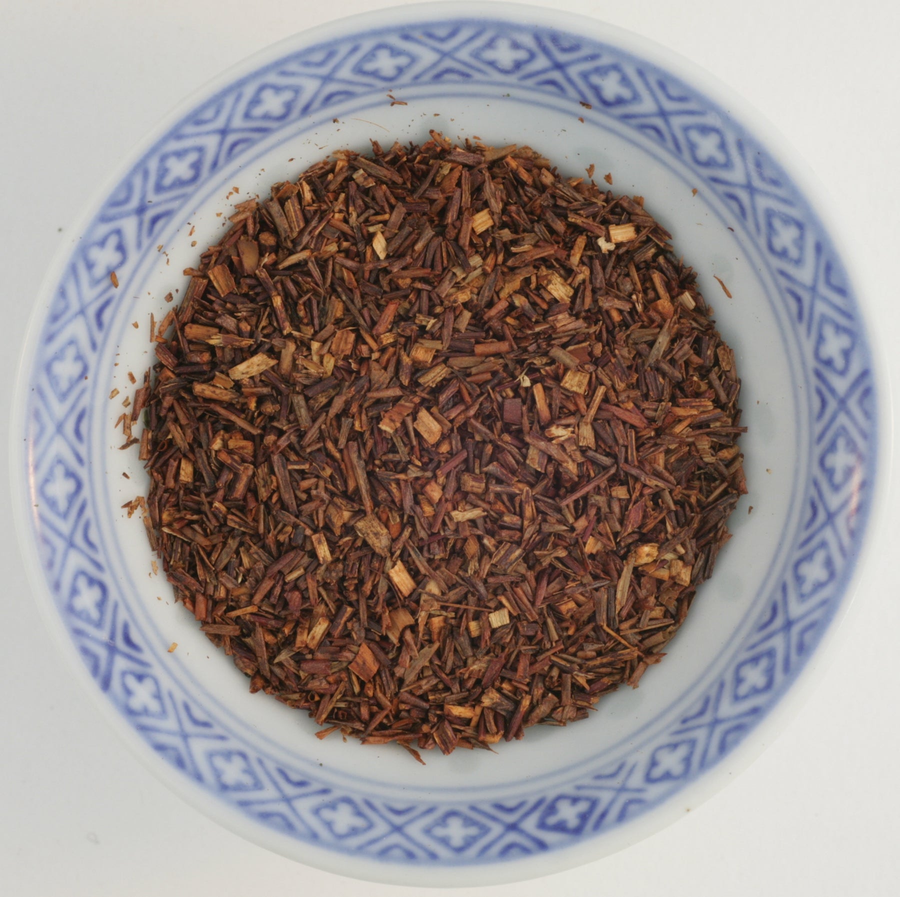 Loose leaf Rooibos Tea (Red Bush Tea)  displaying its unique reddish-brown color, perfect for a caffeine-free relaxation and allergy relief.