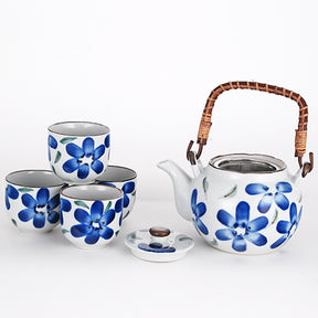 Juego de té de cerámica blanca con estampado de flores azules