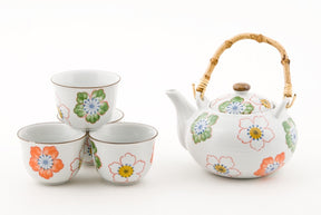 Juego de té de cerámica blanca con flores de colores 