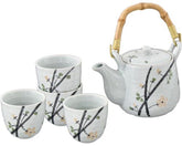 Juego de té moteado de blanco con ramas de flores 
